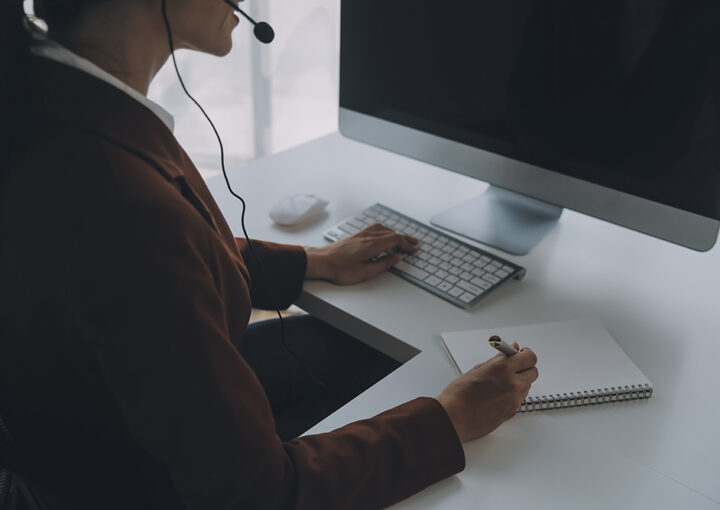 beautiful female call center operator working computer office