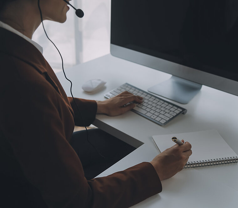 beautiful female call center operator working computer office