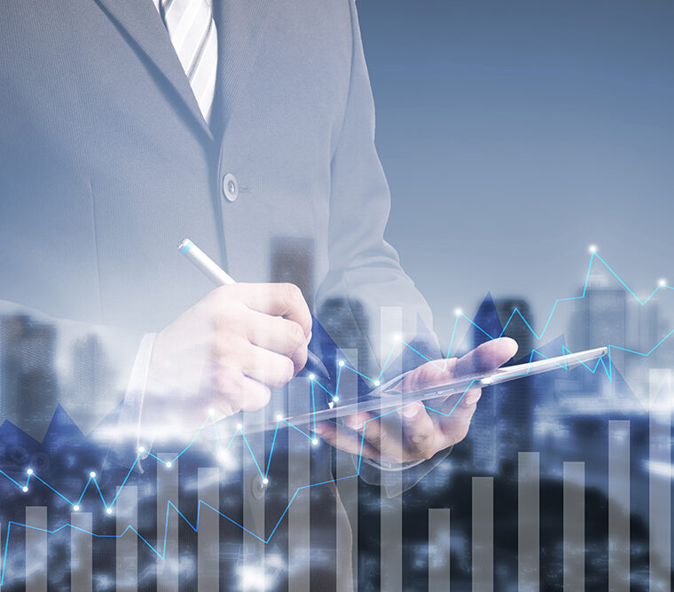 double exposure businessman using digital tablet by graph cityscape